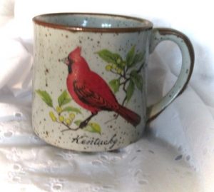 image of cardinal on a coffee cup